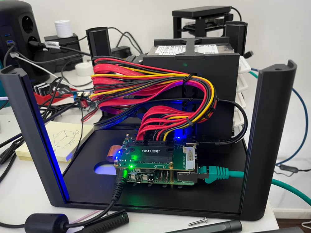 Radxa Penta SATA HAT mounted in the base with cables routed to the drive stack