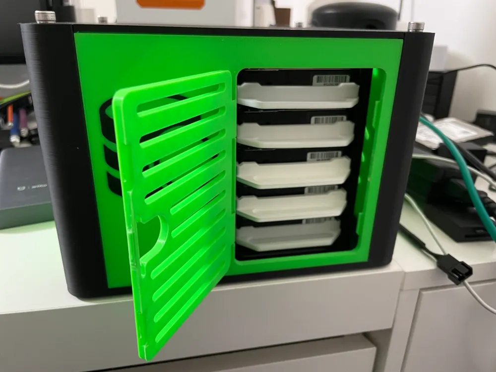 Green hinged front door open to show five removable 2.5-inch drive trays